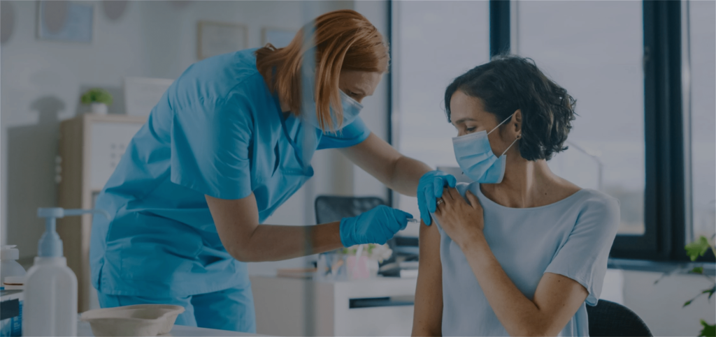 Nurse giving a flu vaccine in Melbourne workplace